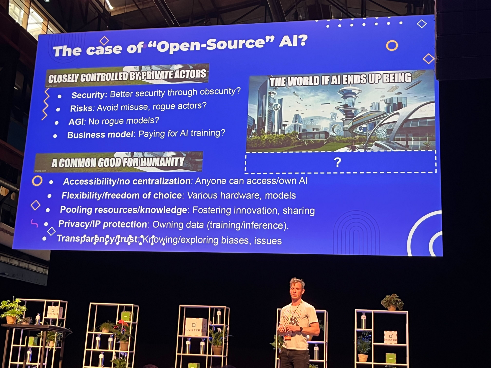 Speaker under a screen with a slide titled "The case of 'Open-Source' AI?"
